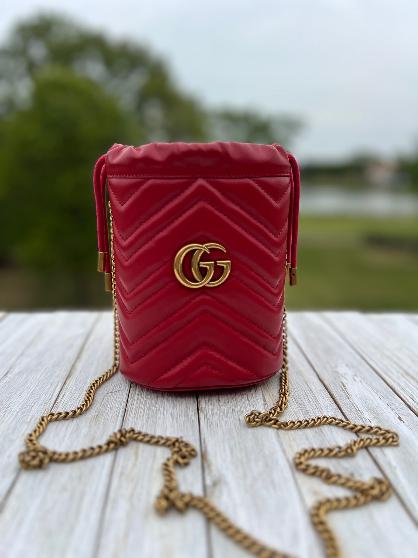 GUCCI
Calfskin Matelasse Mini GG Marmont 2.0 Bucket Bag Hibiscus Red