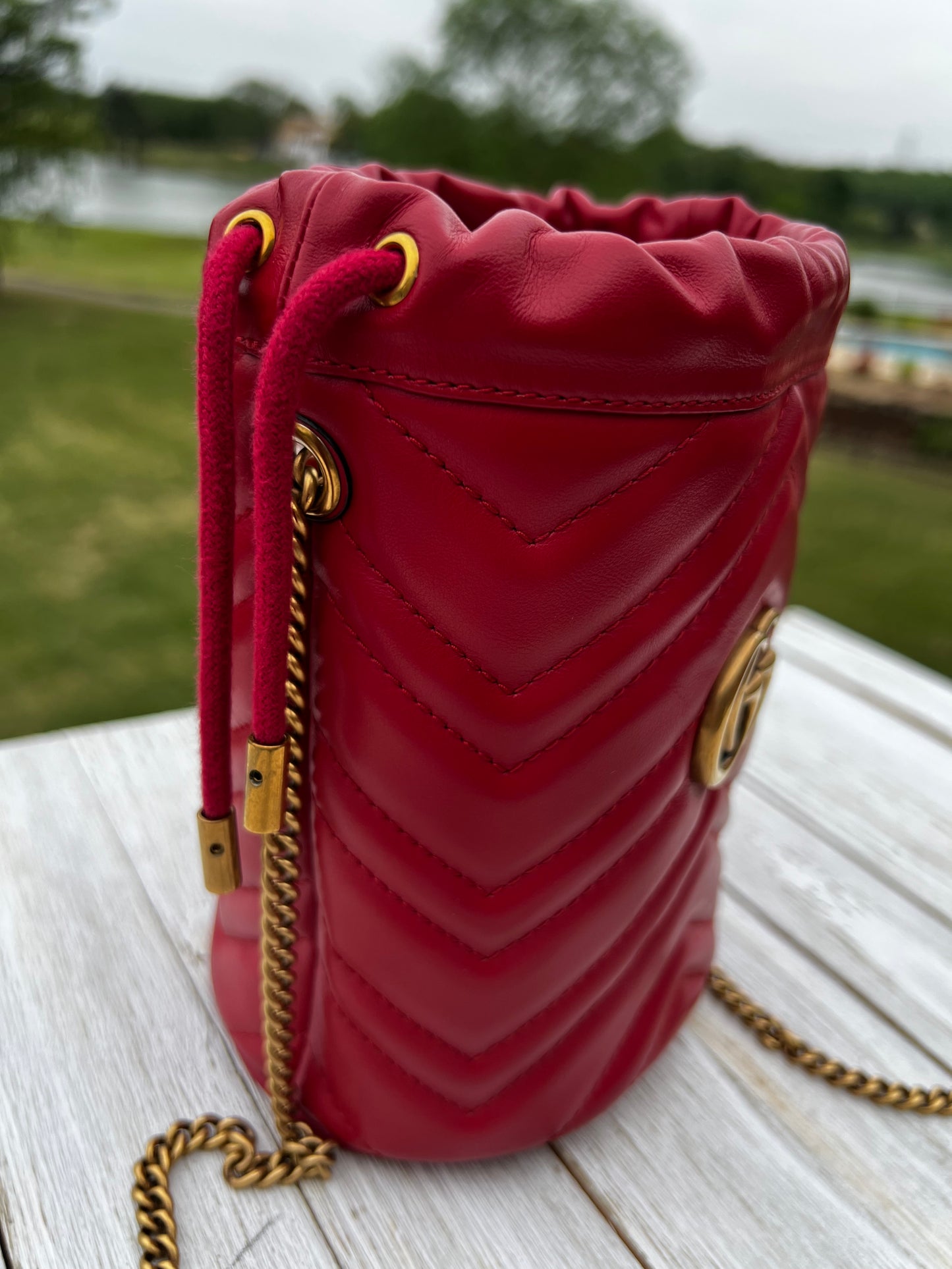 GUCCI
Calfskin Matelasse Mini GG Marmont 2.0 Bucket Bag Hibiscus Red