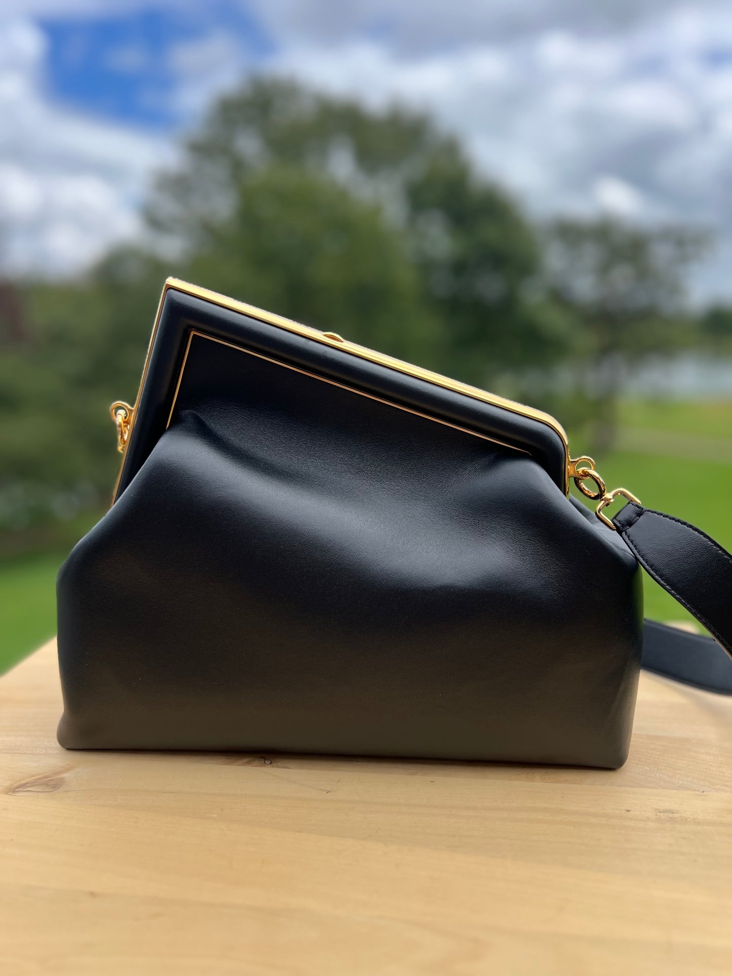 Fendi First Small Bag – Black Nappa Leather with Oversized F Clasp