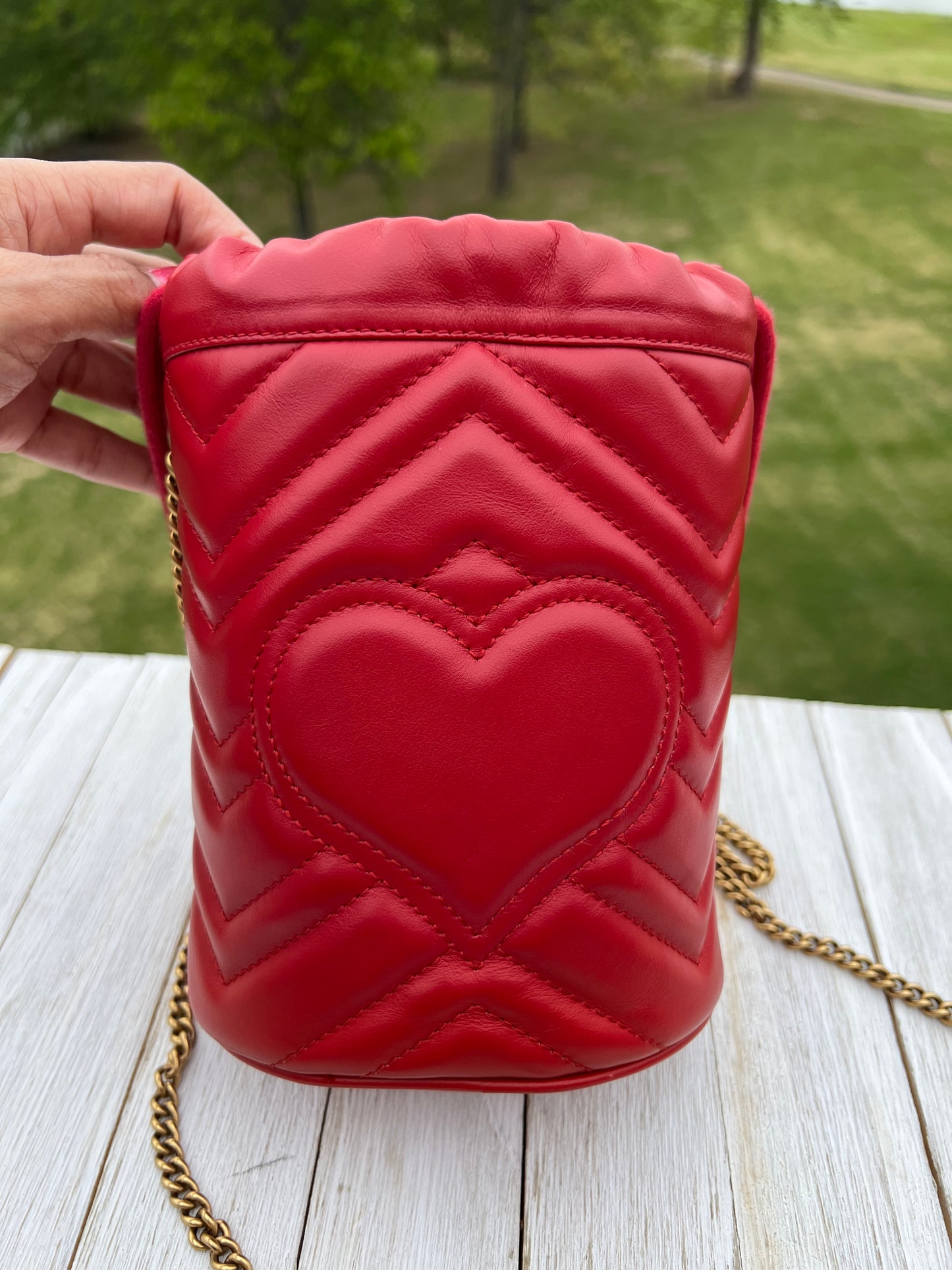 GUCCI
Calfskin Matelasse Mini GG Marmont 2.0 Bucket Bag Hibiscus Red