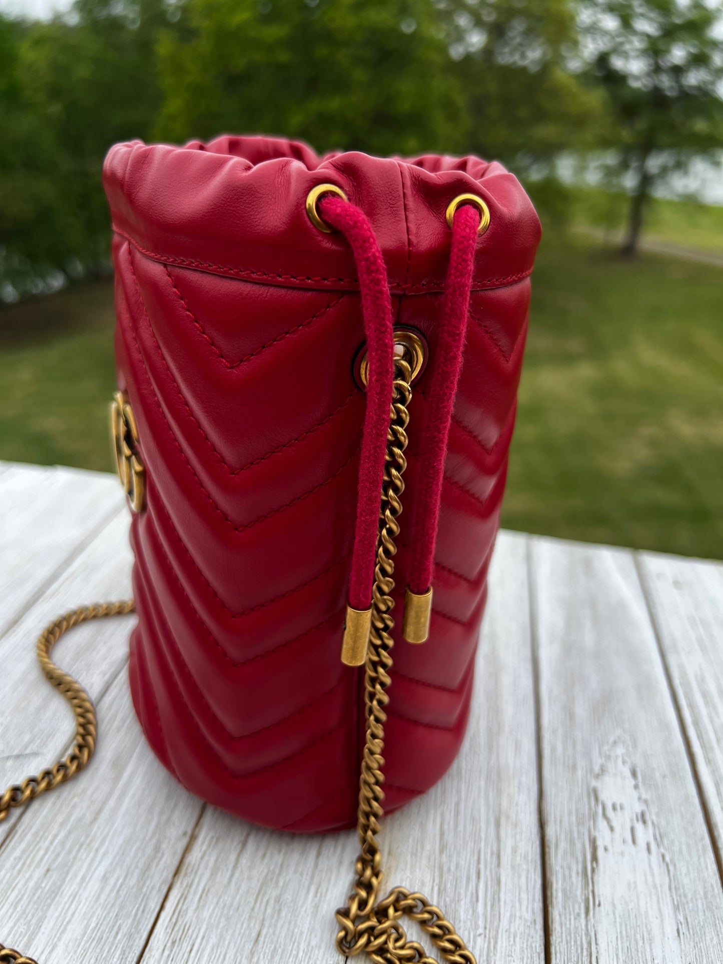 GUCCI
Calfskin Matelasse Mini GG Marmont 2.0 Bucket Bag Hibiscus Red