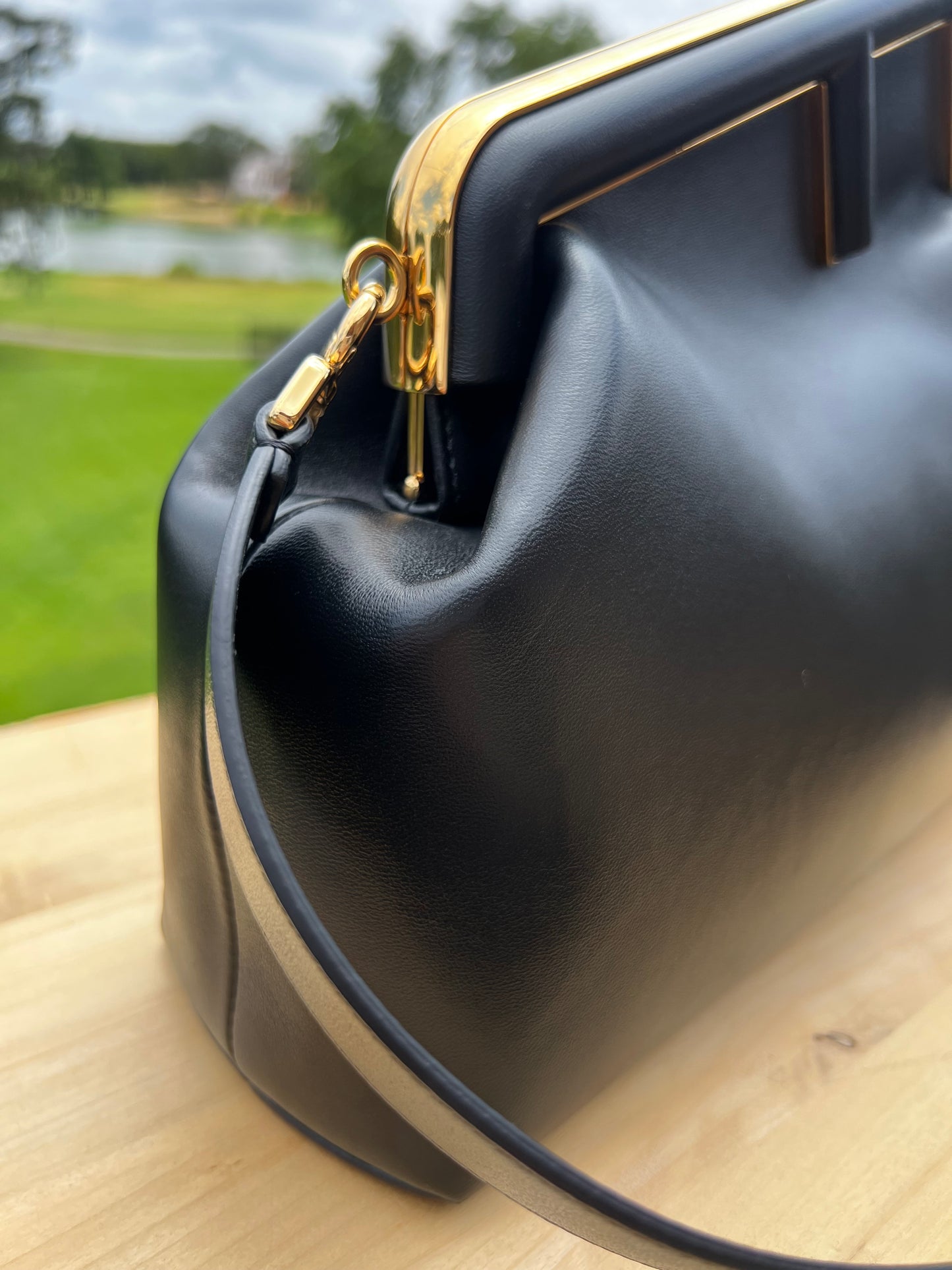 Fendi First Small Bag – Black Nappa Leather with Oversized F Clasp