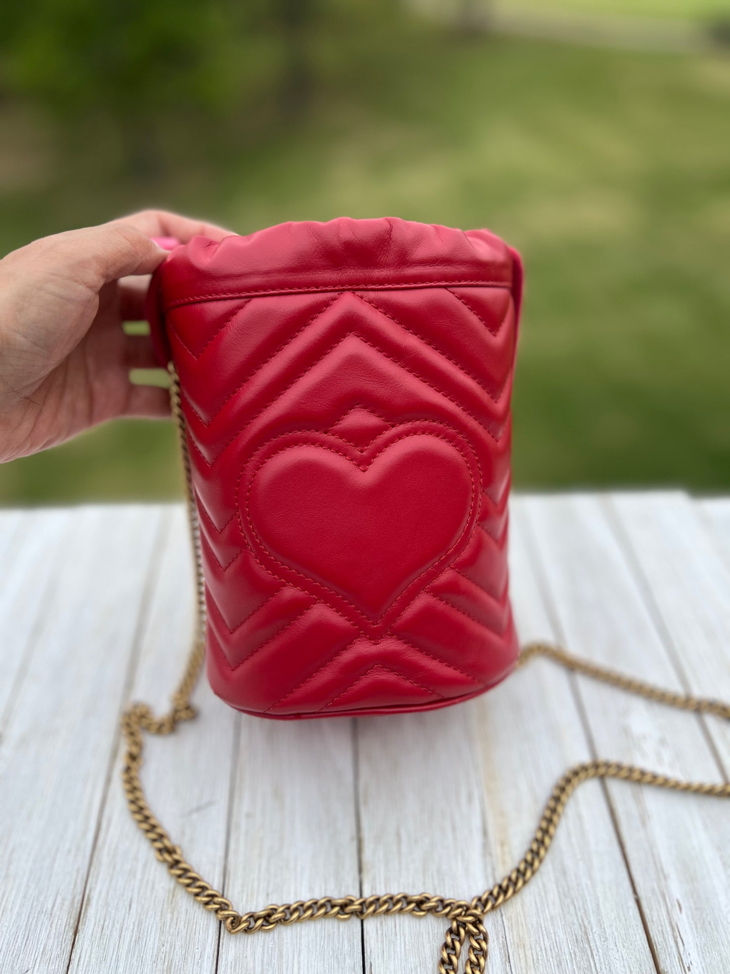 GUCCI
Calfskin Matelasse Mini GG Marmont 2.0 Bucket Bag Hibiscus Red