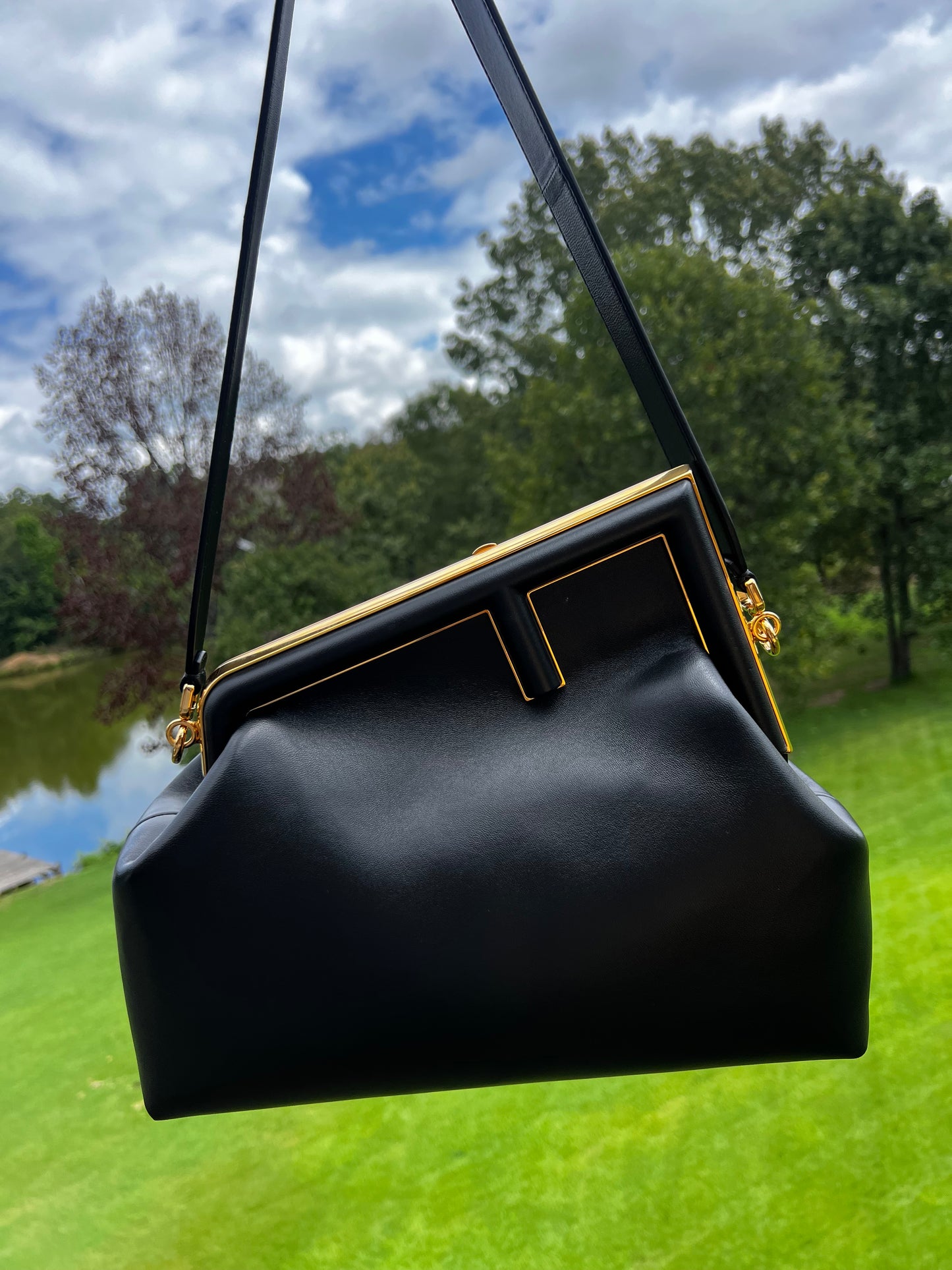 Fendi First Small Bag – Black Nappa Leather with Oversized F Clasp