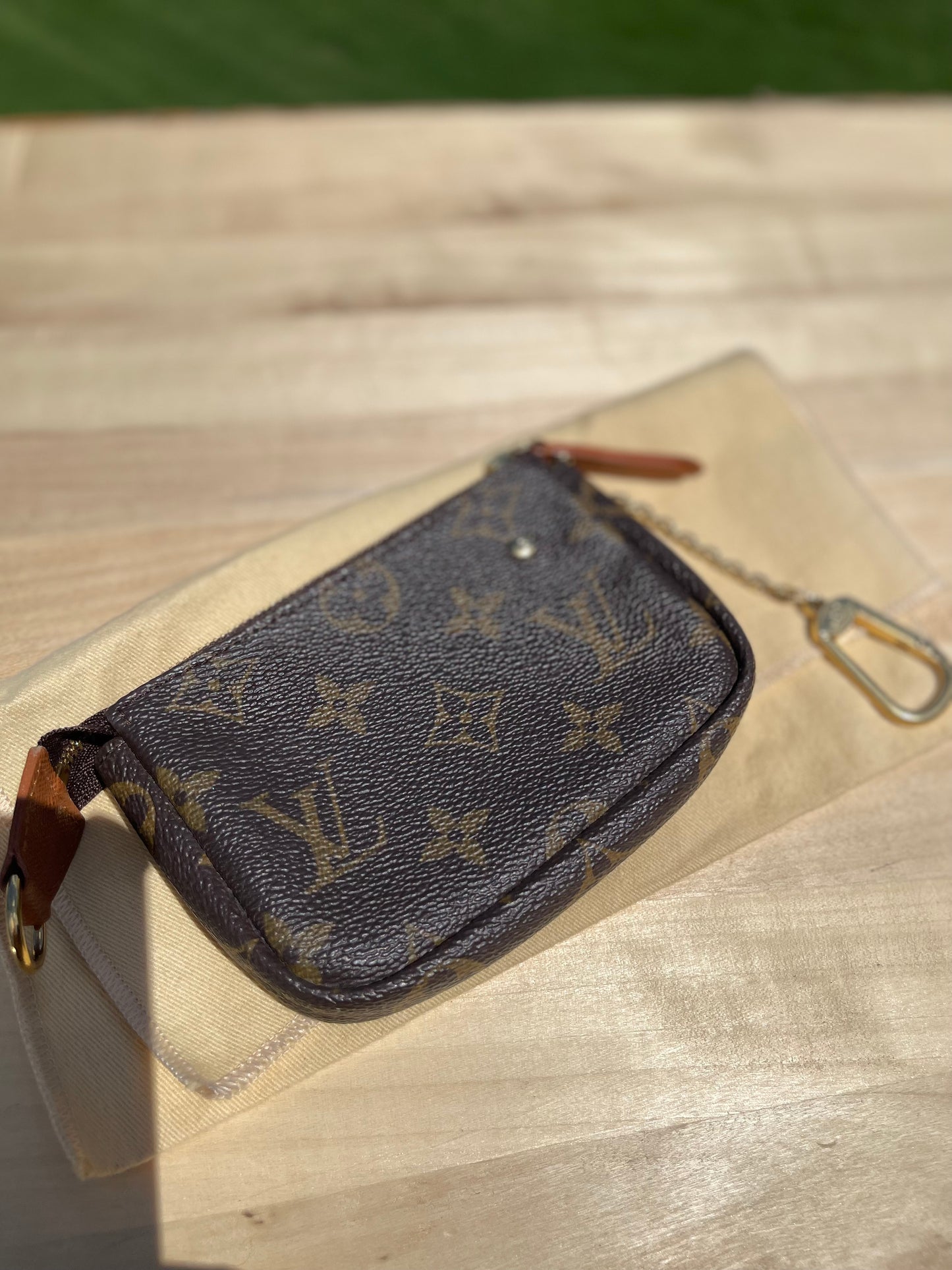 LOUIS VUITTON
Monogram Trunks Mini Pochette Accessories