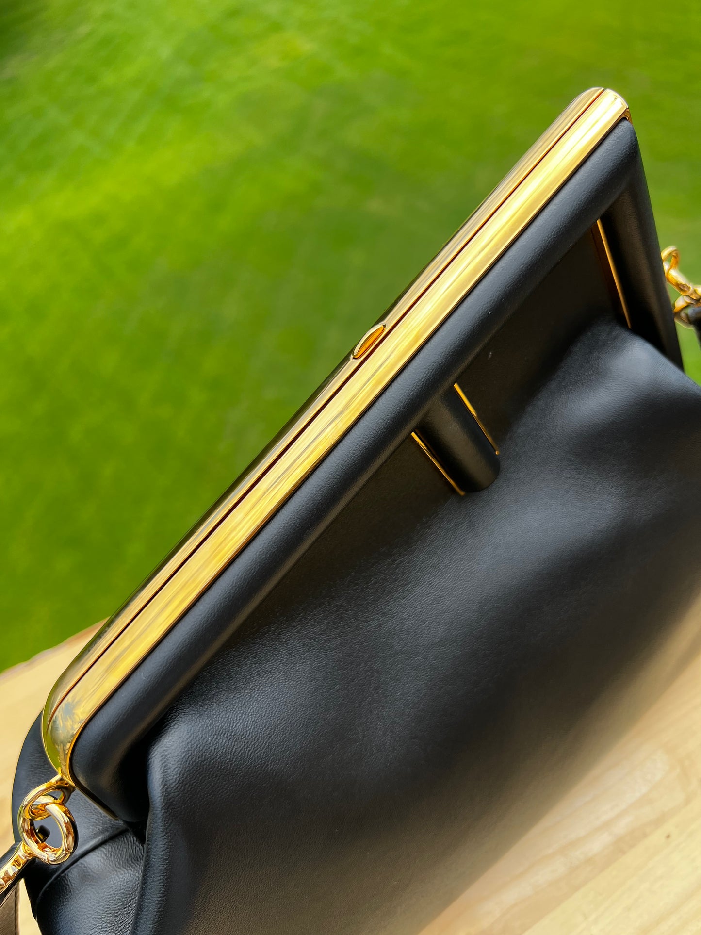 Fendi First Small Bag – Black Nappa Leather with Oversized F Clasp