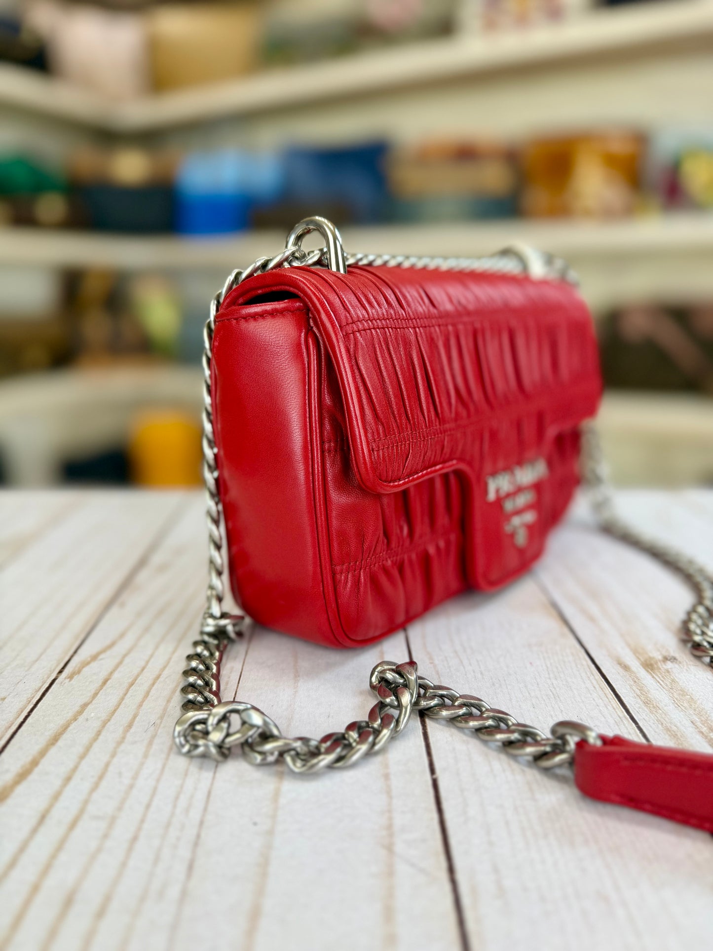 PRADA
Fuoco Nappa Gaufre Leather Chain Flap Bag