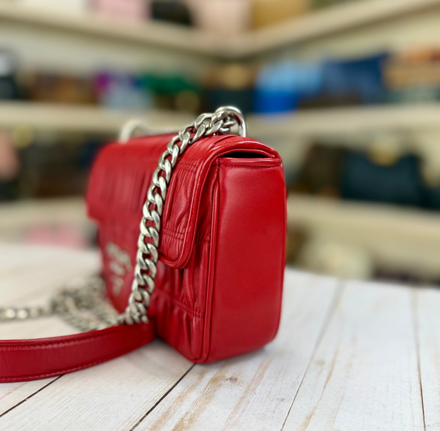 PRADA
Fuoco Nappa Gaufre Leather Chain Flap Bag