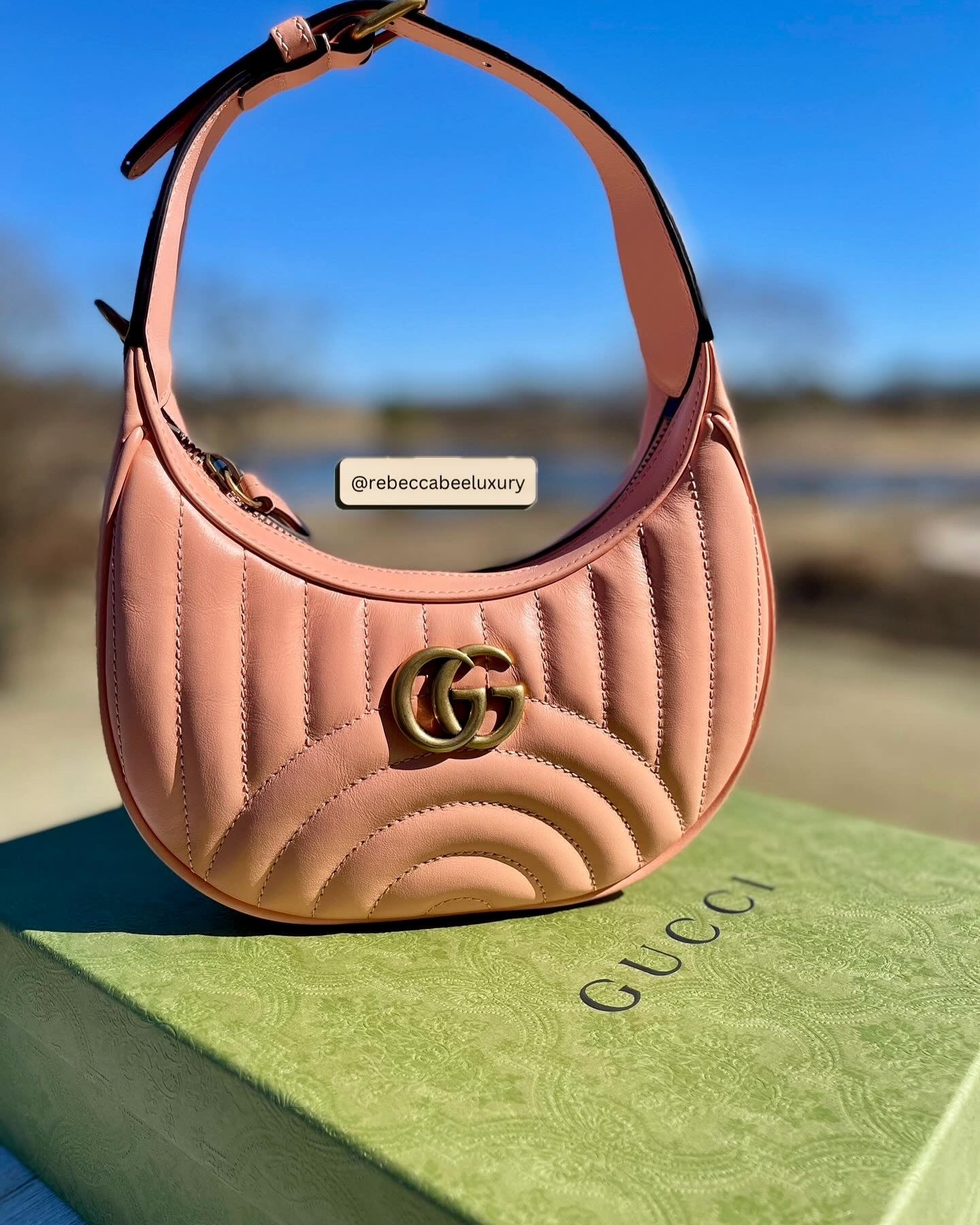 GUCCI 
Calfskin Vertical Ring Matelasse Mini GG Marmont Half Moon Hobo Peachy Chic