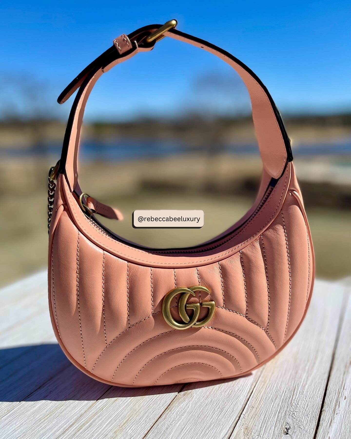 GUCCI 
Calfskin Vertical Ring Matelasse Mini GG Marmont Half Moon Hobo Peachy Chic