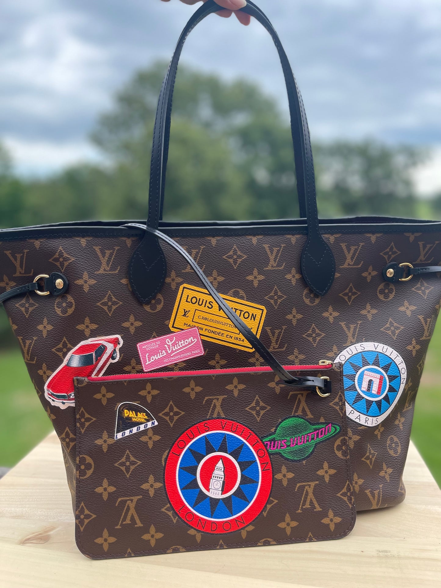 LOUIS VUITTON 
Monogram World Tour Neverfull MM