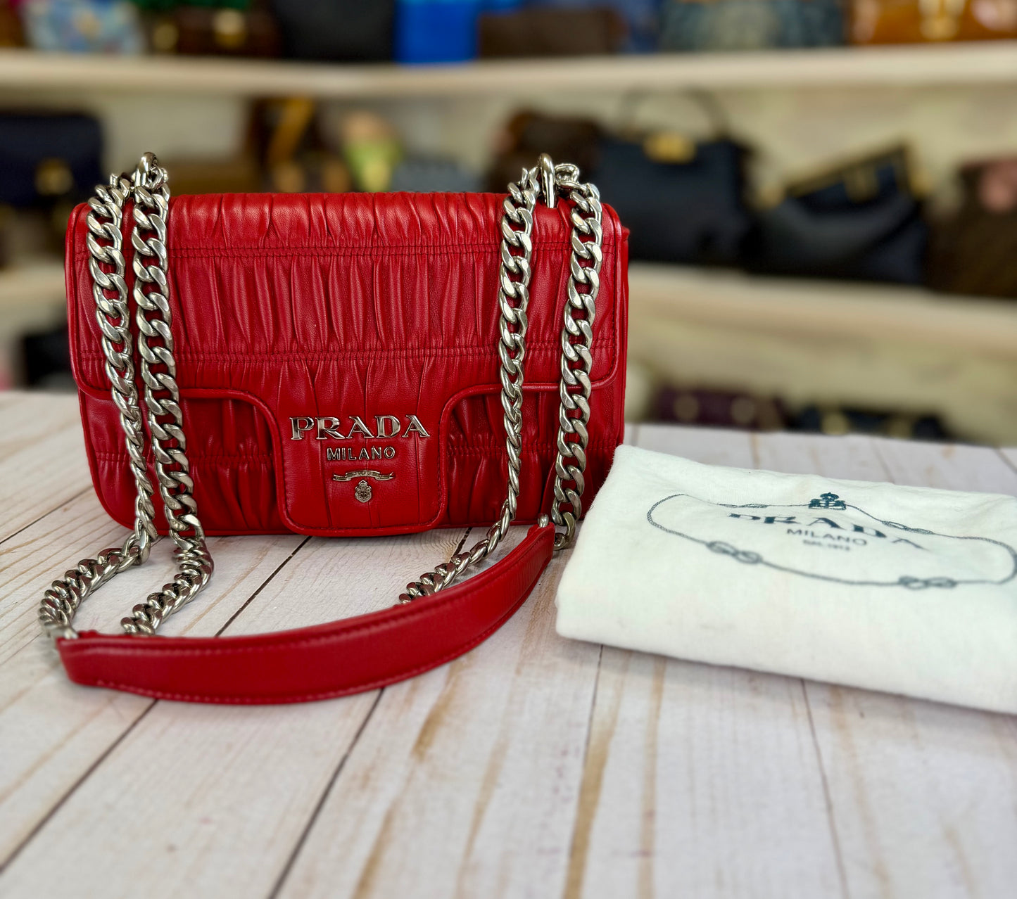 PRADA
Fuoco Nappa Gaufre Leather Chain Flap Bag