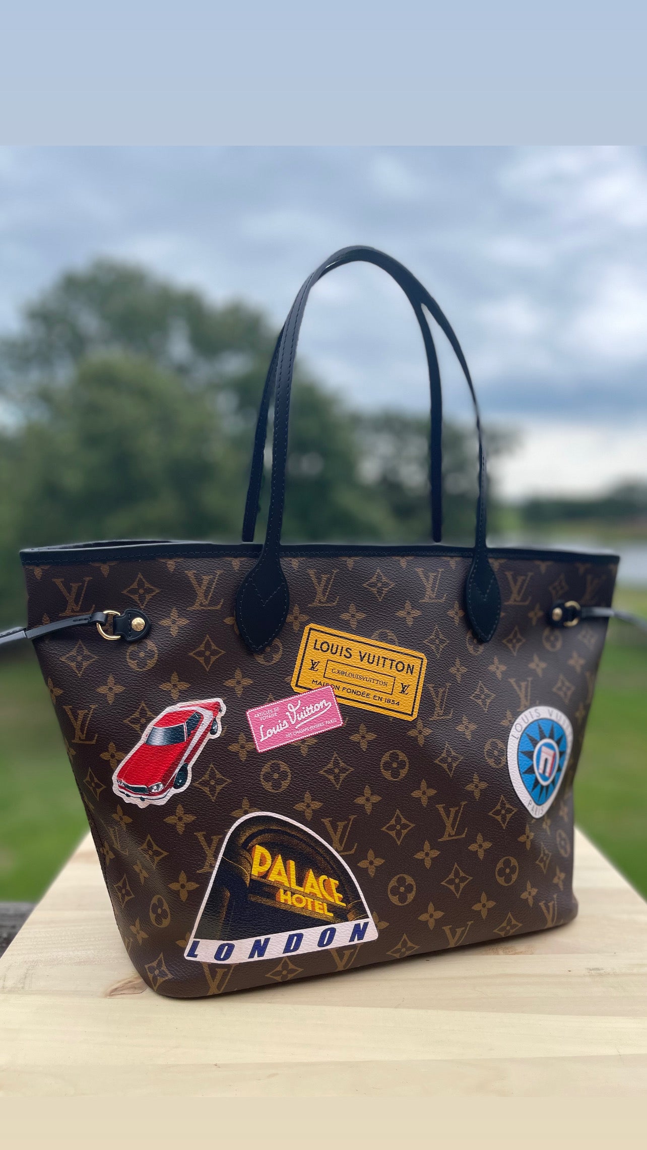 LOUIS VUITTON 
Monogram World Tour Neverfull MM