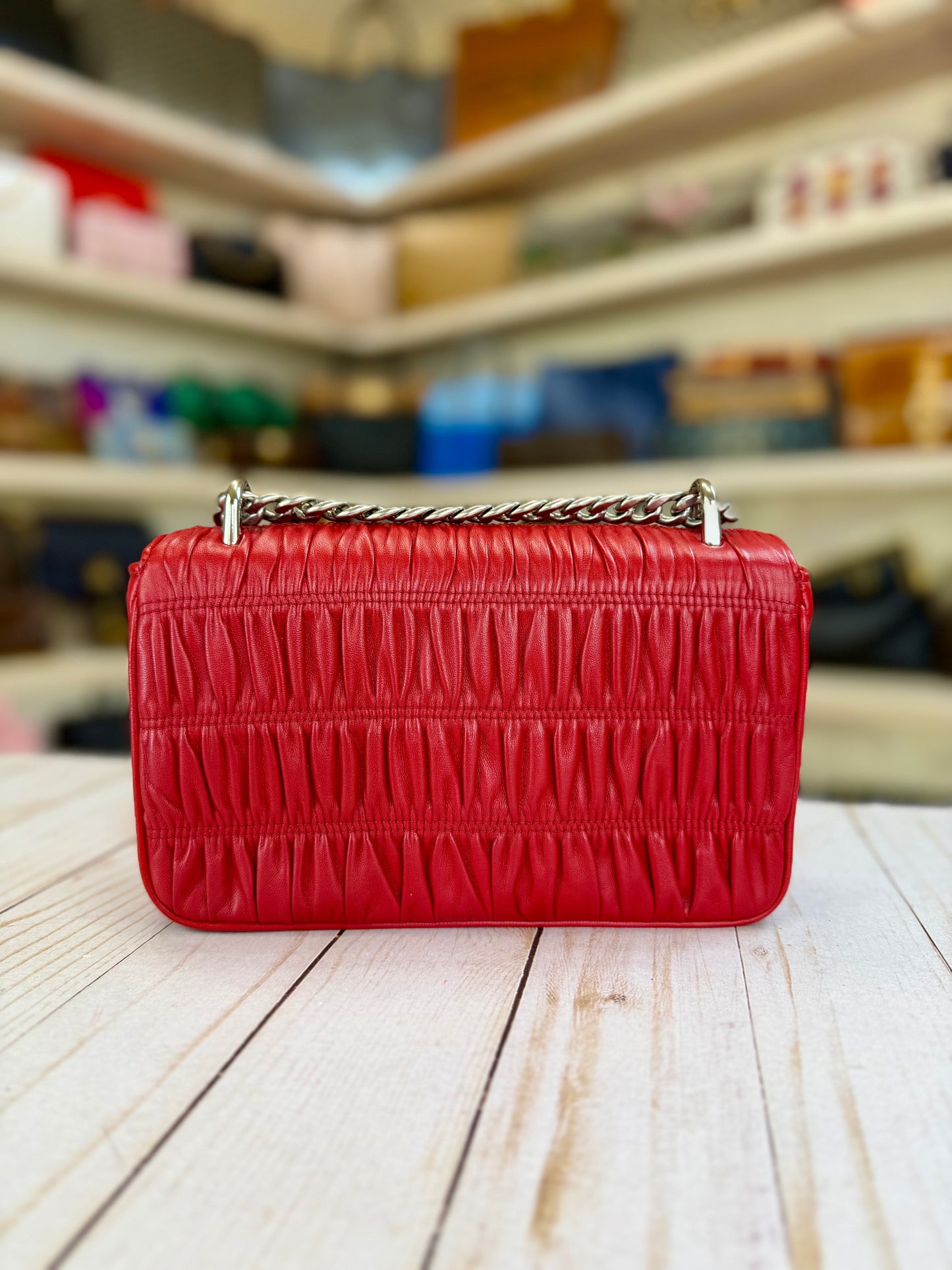 PRADA
Fuoco Nappa Gaufre Leather Chain Flap Bag