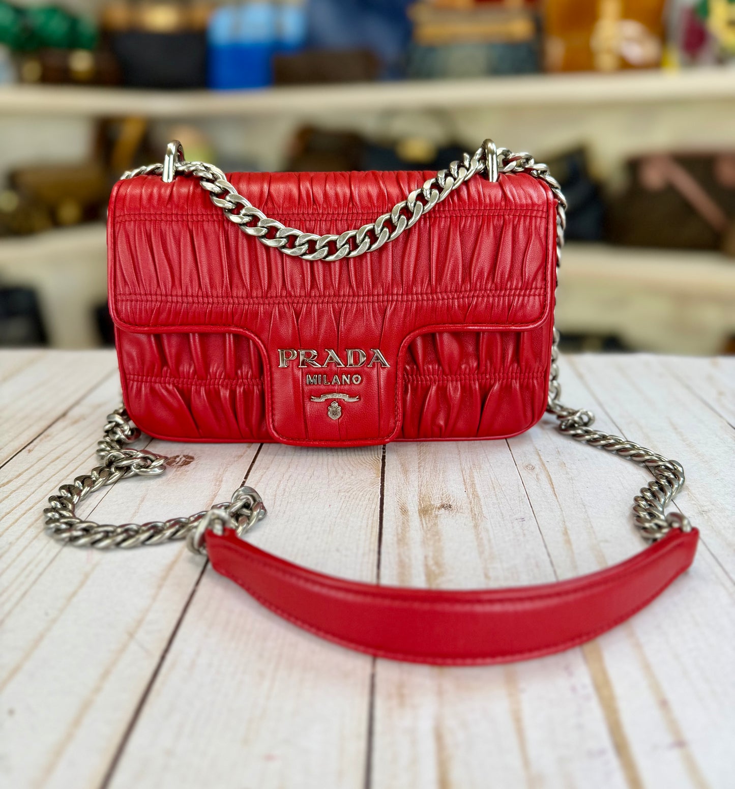 PRADA
Fuoco Nappa Gaufre Leather Chain Flap Bag