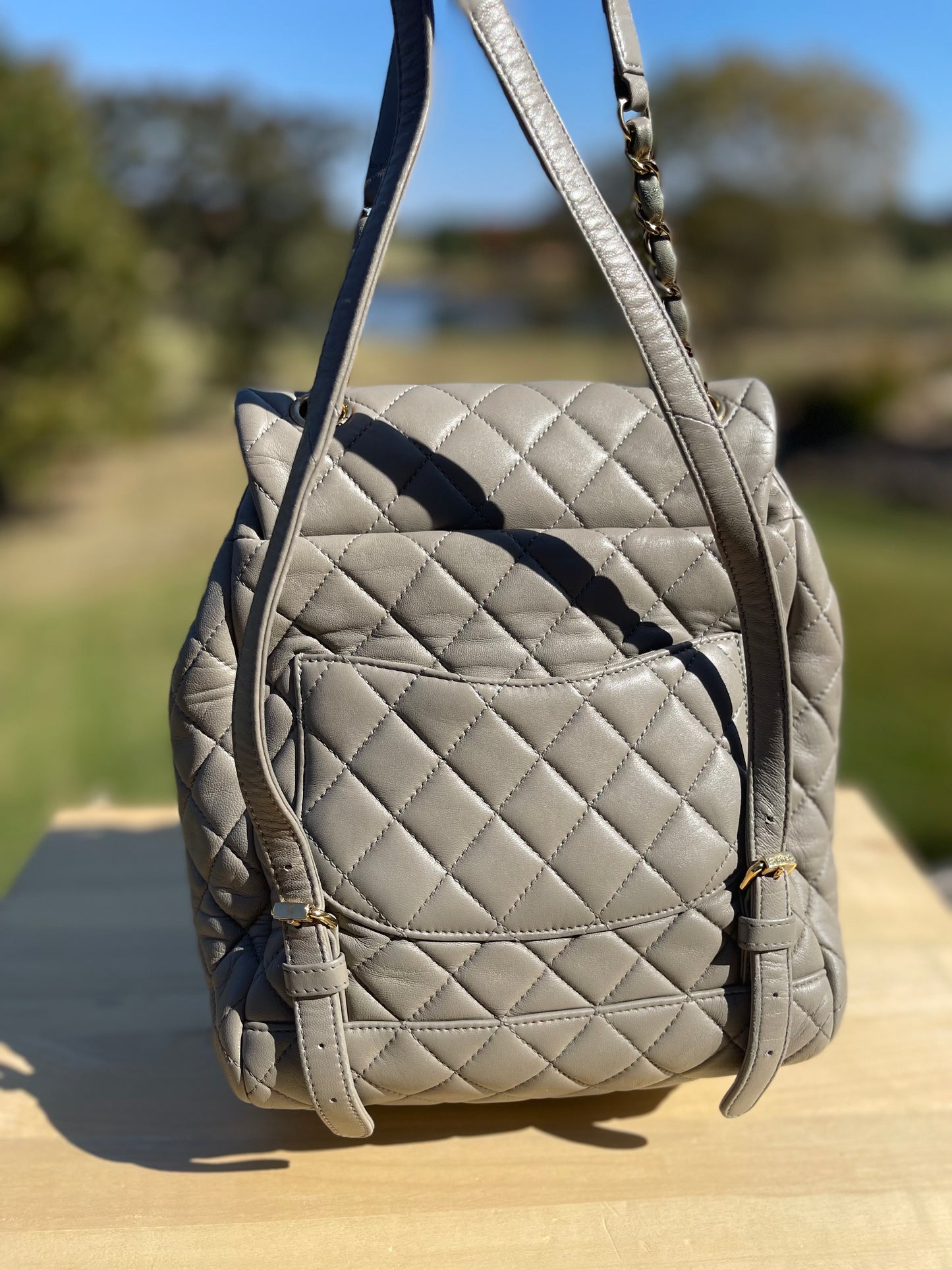 CHANEL 
Calfskin Quilted Mini Urban Spirit Backpack Grey with light gold hardware