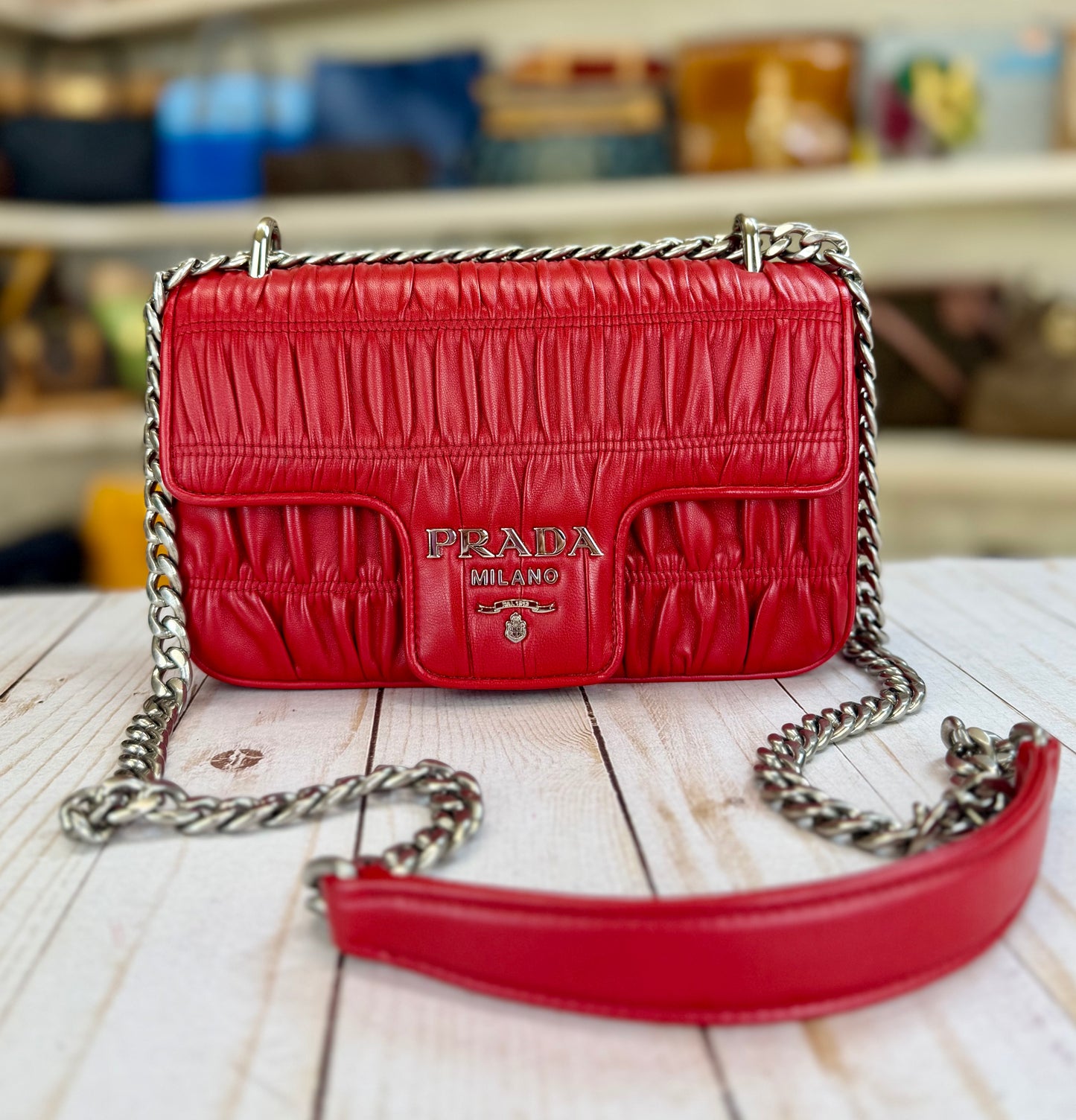 PRADA
Fuoco Nappa Gaufre Leather Chain Flap Bag