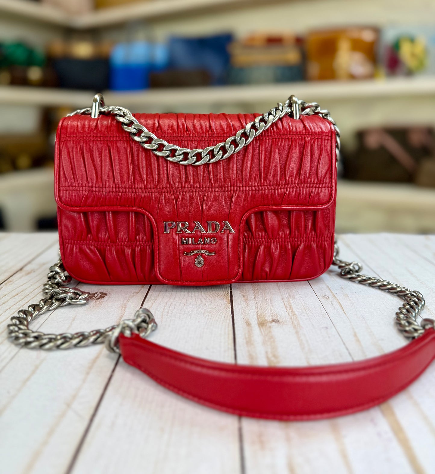 PRADA
Fuoco Nappa Gaufre Leather Chain Flap Bag