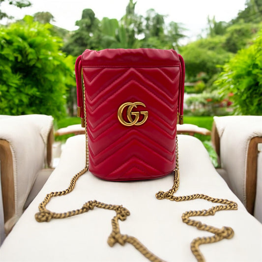 GUCCI 
Calfskin Matelasse Mini GG Marmont 2.0 Bucket Bag Hibiscus Red