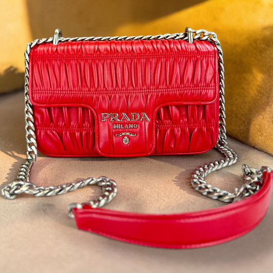 PRADA
Fuoco Nappa Gaufre Leather Chain Flap Bag